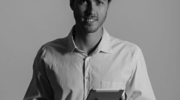 smiley-businessman-with-tablet